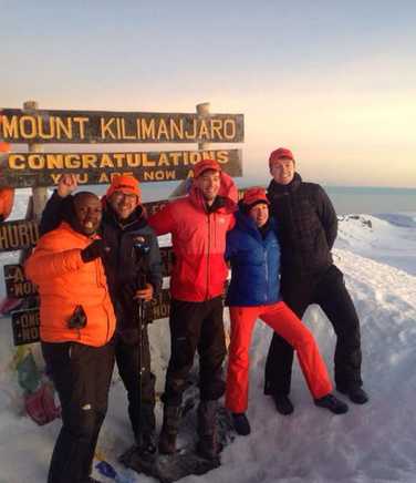 Kandoo team at the summit of Mount Kilimanjaro