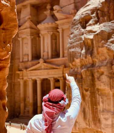Man pointing at Petra