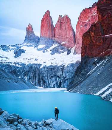 Man standing on rock in Torres del Paine National Park