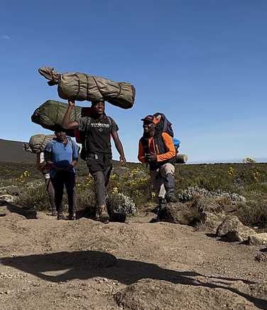 Porters and Kandoo Adventures guide on Kilimanjaro
