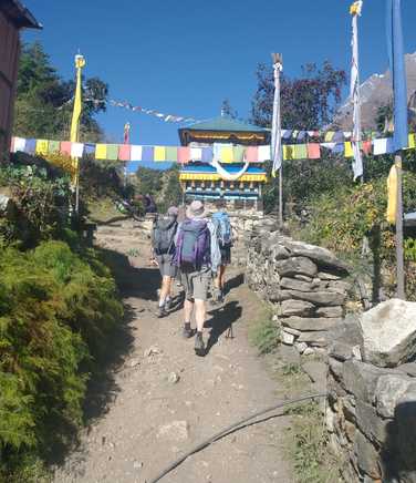 trekking-beneath-fluttering-prayer-flags