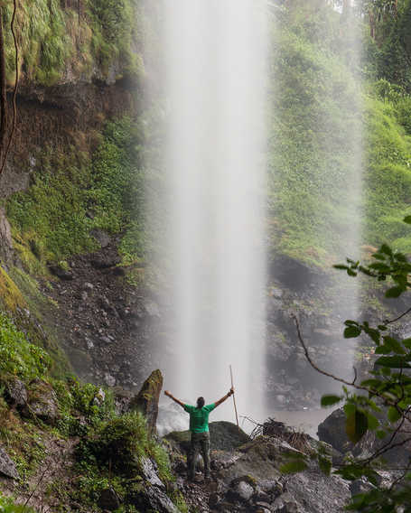 Guide at the bottom of Sipi Falls in Uganda