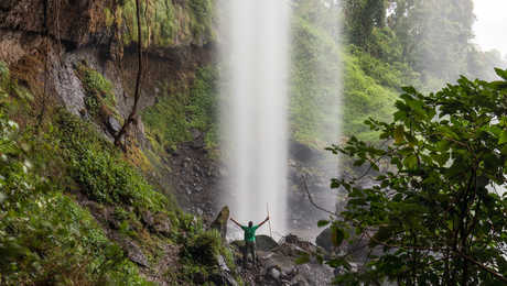 Guide at the bottom of Sipi Falls in Uganda