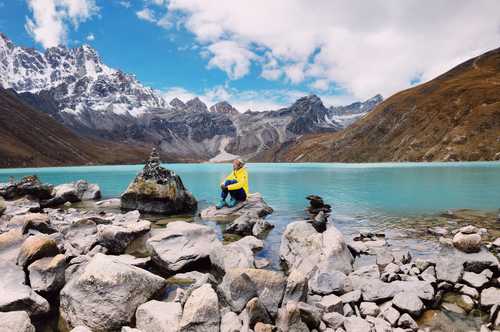 Hiker in front of Gokyo lake, Nepal