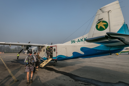 Passangers  boarding small plane at Kathmandu