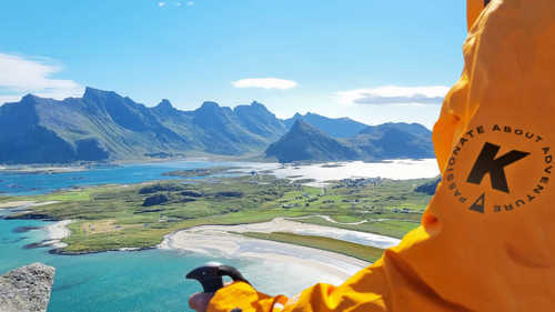 Person in a Kandoo jacket looking over the Lofoten Islands