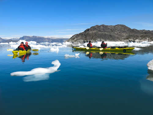 Sea-kayaking among icebergs in Greenland