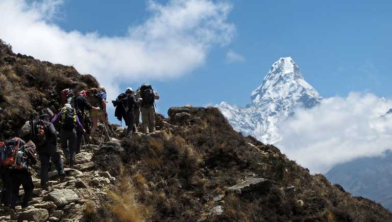 Hikers in front of Ama Dablam