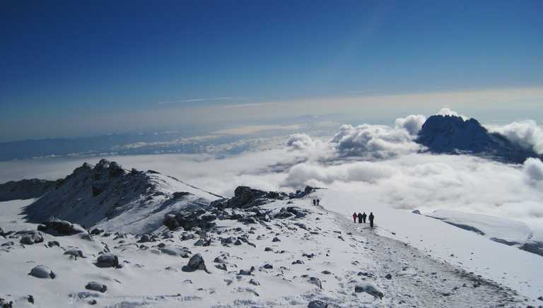 Treking on Kilimanjaro plateau, between clouds and snow