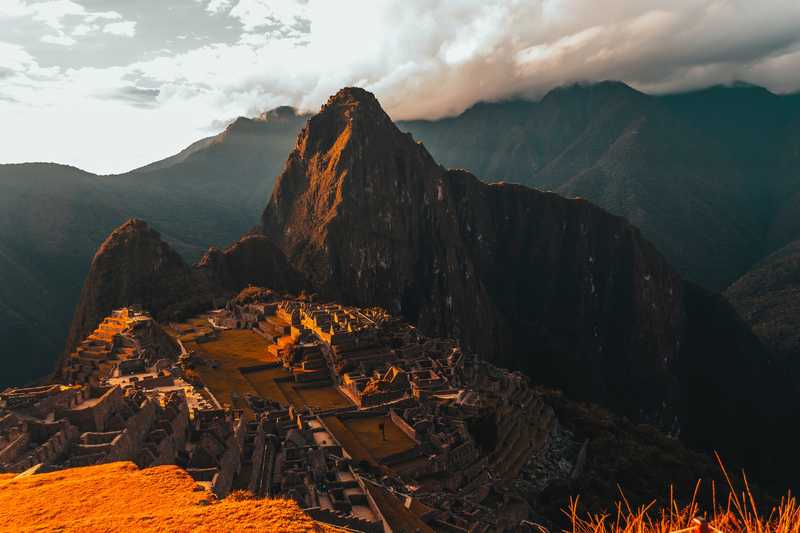 Machu Picchu bathed in orange light