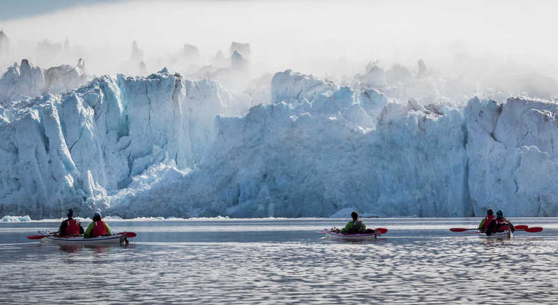 Kayaking near glacier in Spitsbergen, Svalbard